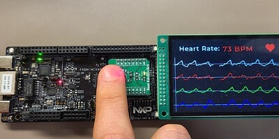 A finger pressing down on a Optical heart rate sensor