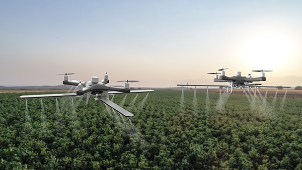 Large drones have been developed that can be used to apply spray treatments Der er blevet udviklet et billede af store droner, der kan bruges til at sprøjte behandlinger