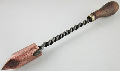 A historical tool used as soldering iron