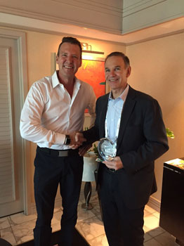 Image of Jeff Thomson presents award to David Stein