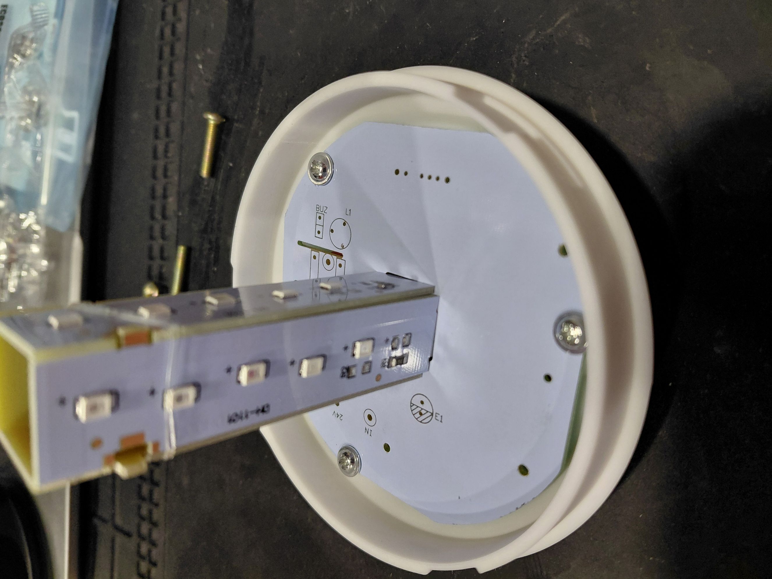 PCB assembly mounted in new base