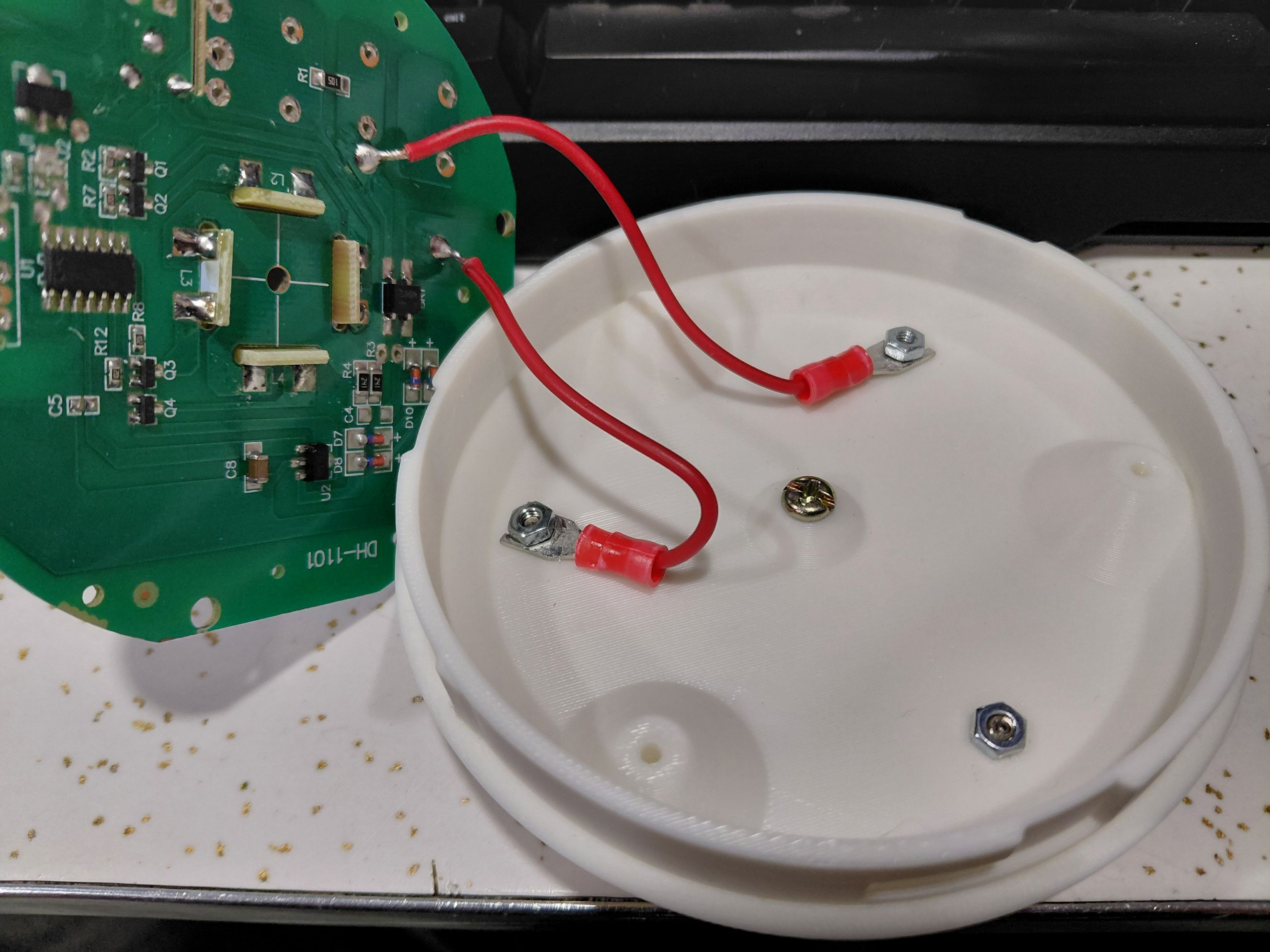 PCB with wires attached to nuts