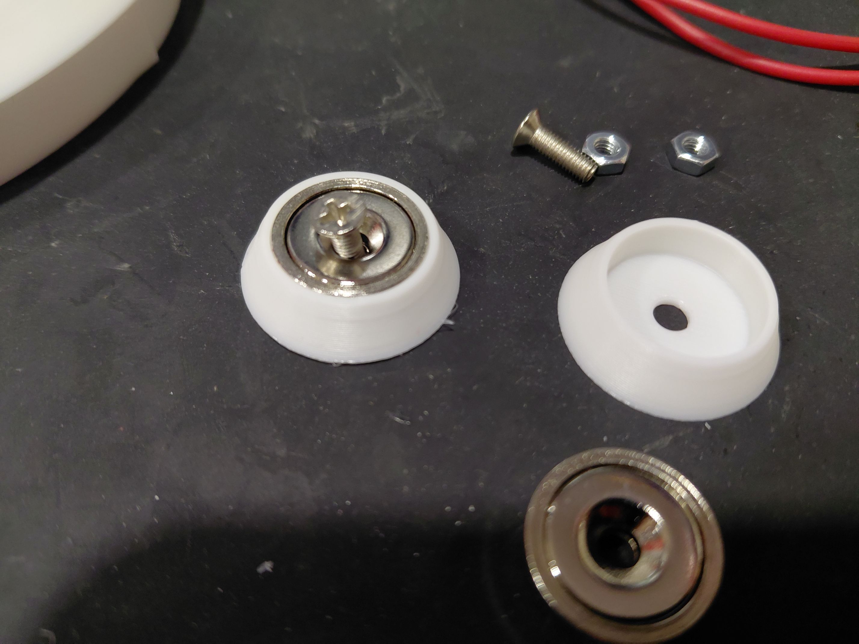 3d printed parts with magnet and screw installed